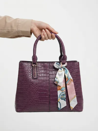 شنطة لون عنبري